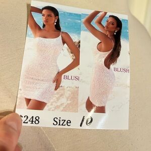 White with multicolored accented sequins short formal dress.